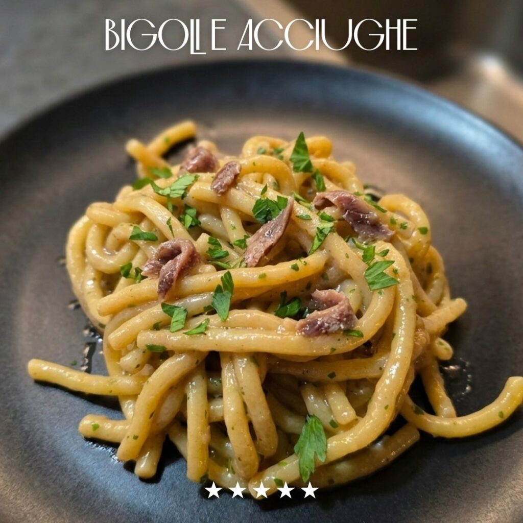 Bigoli con acciughe nel piatto